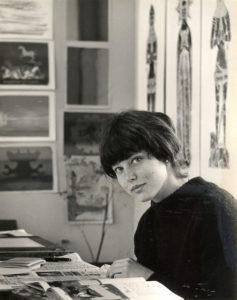 Artist Pamela Hahn (circa 1964), seated in front of three Dorr Bothwell tomb rubbings.