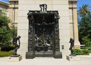 Rodin's Gates of Hell, flanked by the figures of Adam and Eve, at the B. Gerald Cantor Rodin Sculpture Garden, Cantor Arts Center, Stanford University, Palo Alto, California. The Rodin Sculpture Garden is open at all hours, with lighting for nighttime viewing.