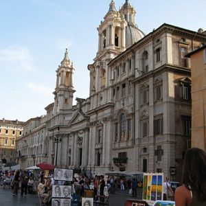 The Chiesa di Sant'Angese in Agone stands on the western side of Piazza Navona. In Bill Zacha's Roma (1952), one of the church's twin bell towers (Francesco Borromini, c. 1652) is visible at the top right.